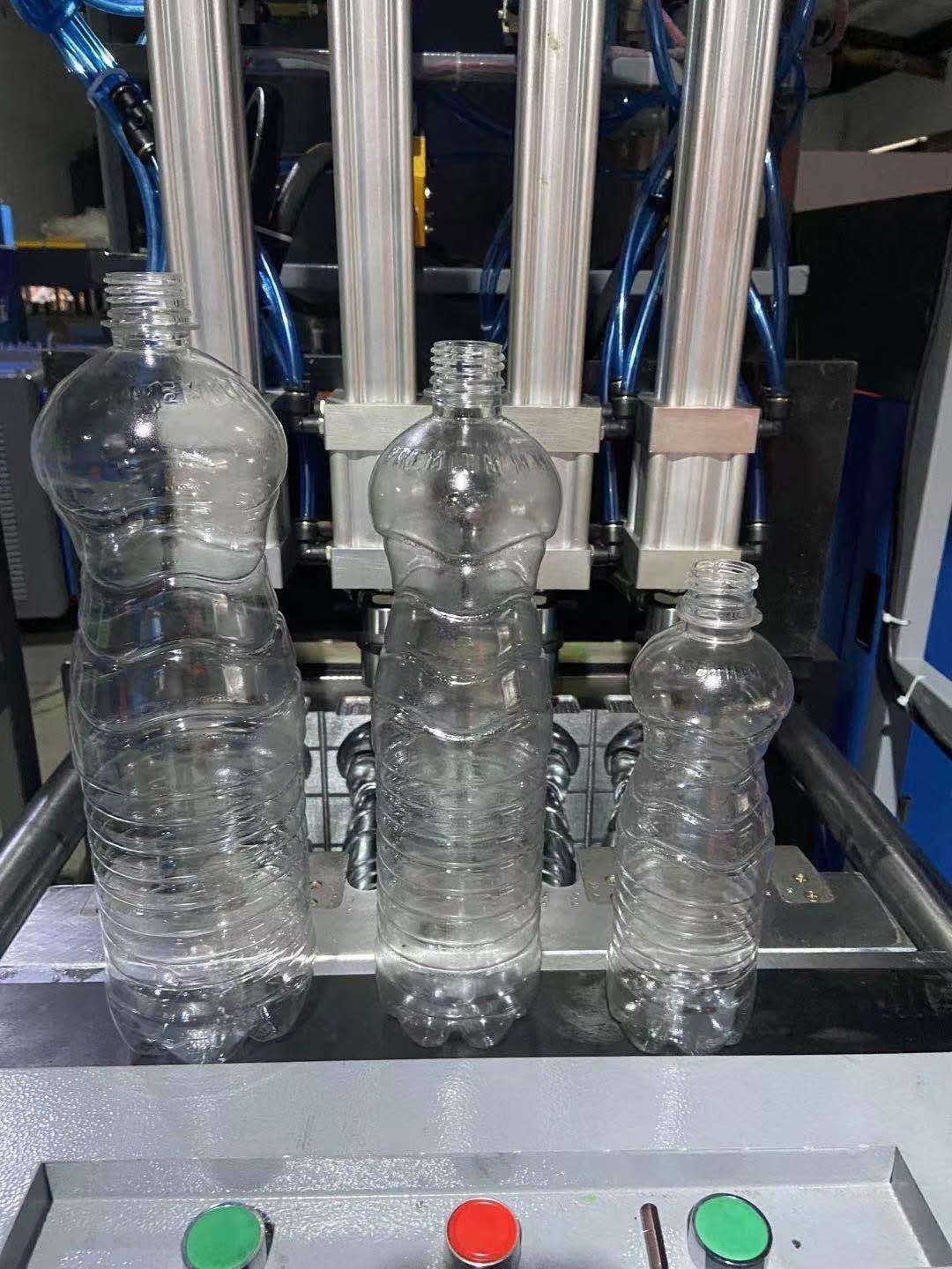 Factory price 4 Cavities semi-automatic blow moulding machine 330ml 500ml Plastic PET Bottle Making Blowing Machine