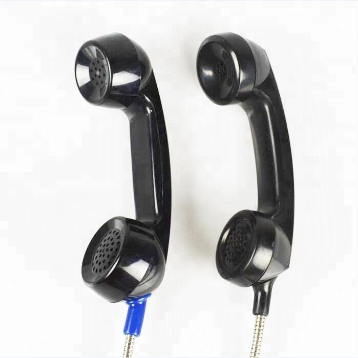 Hotel reception desk old limited telephone public phone booth cellular receiver, microphone and speaker handset
