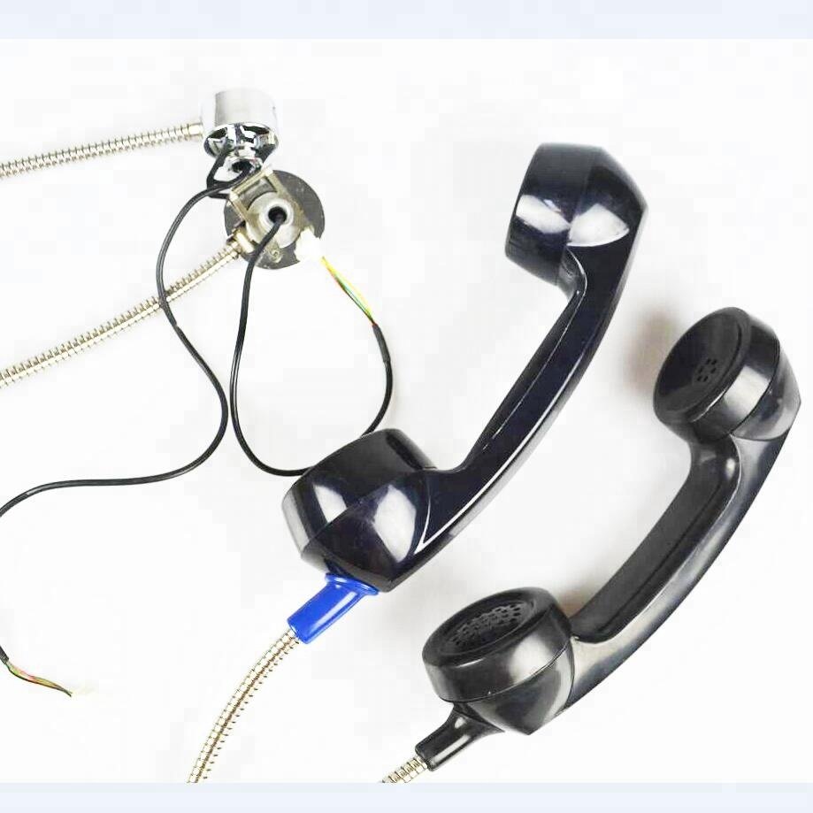 Hotel reception desk old limited telephone public phone booth cellular receiver, microphone and speaker handset