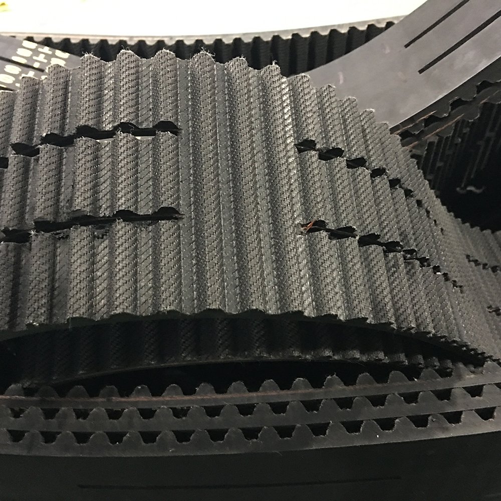 Slotted rubber timing belt