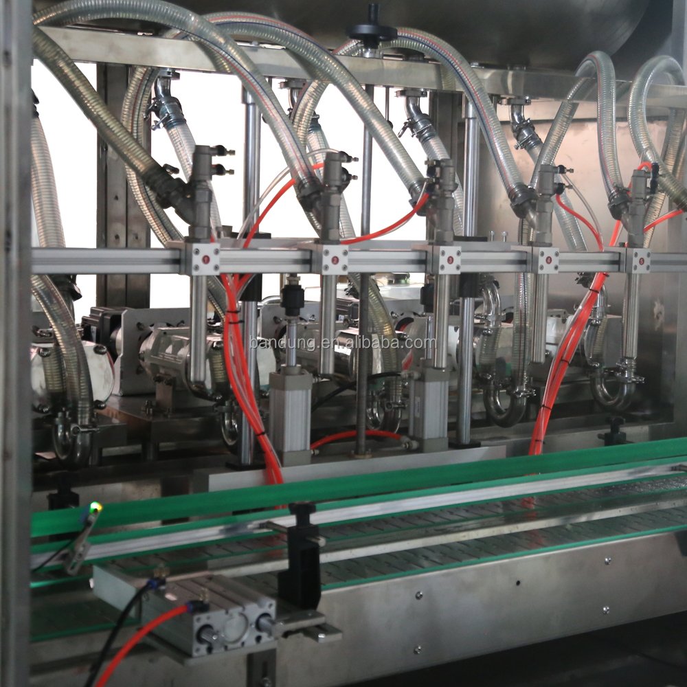 Automatic Glass Bottle Jar Can Rotor Pump Chunk Chili Sauce Meat Paste Sauce Filling Machine With Heating Mixing Stirrer Tank