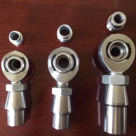 Heavy duty suspension parts heim joint with misalignment spacers, welded bung and jam nuts