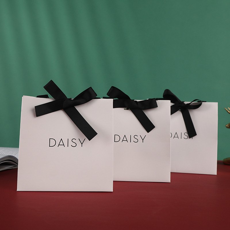 Custom Printed Fancy Logo Black Bow Tie White Cardboard Luxury Gift Jewelry Paper Shopping Bag With Ribbon Handle