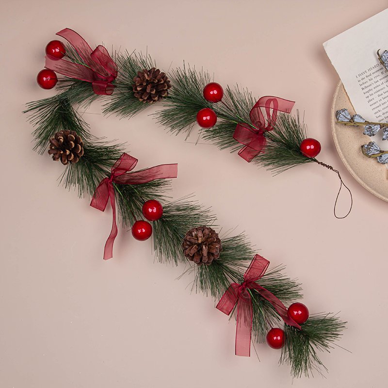 The front door is tied with a bow pine needle Christmas Garland Christmas decoration garland or Vine as Christmas