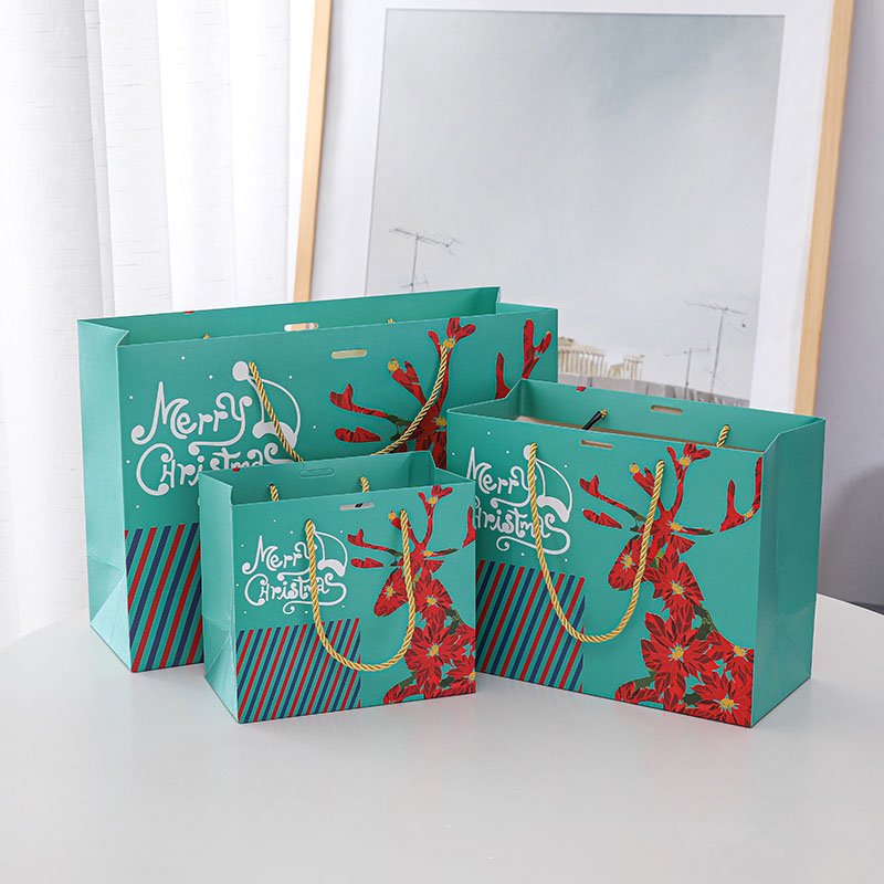 High Quality Customized Factory Recycled Doypack Christmas Gift Packaging Elk Santa Pattern Paper Bag With Bow Tie Ribbon Handle