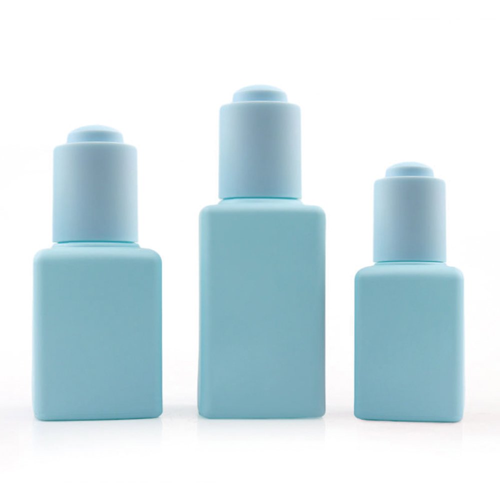 Personalized glass dropper bottle with aluminum collar for cosmetic applications