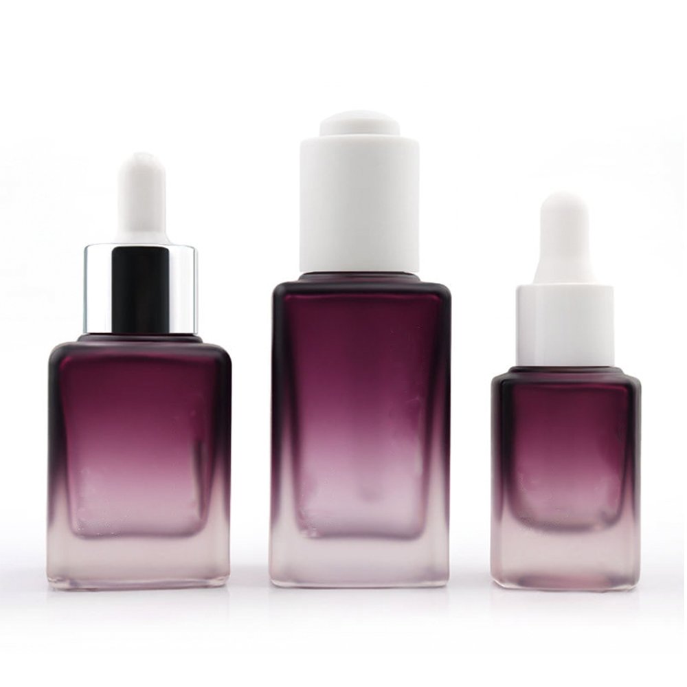 Personalized glass dropper bottle with aluminum collar for cosmetic applications