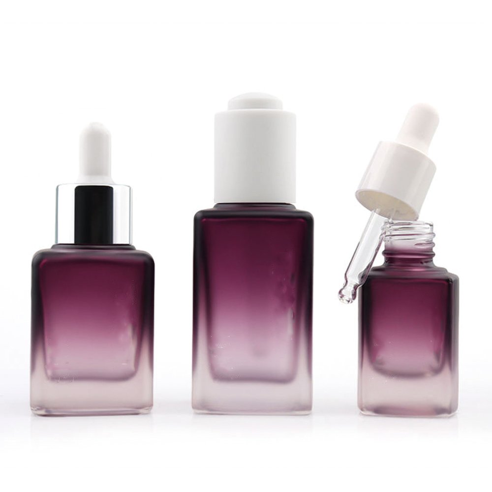 Personalized glass dropper bottle with aluminum collar for cosmetic applications