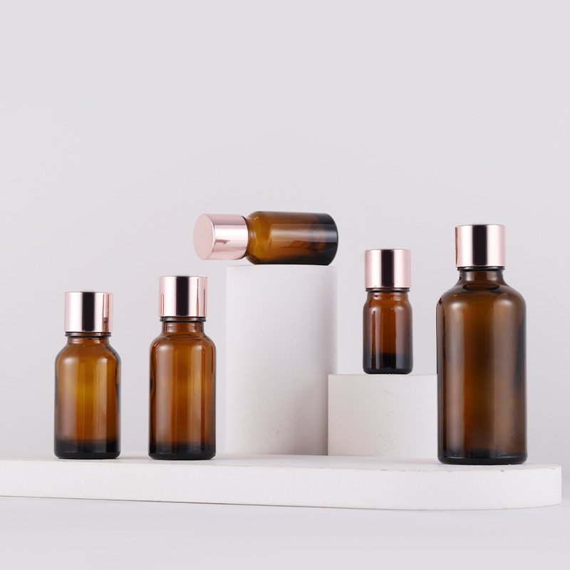 Rose Gold Round Shape Essence Serum Hair Oil Bottle Pink Glass Eye Pink Bottle