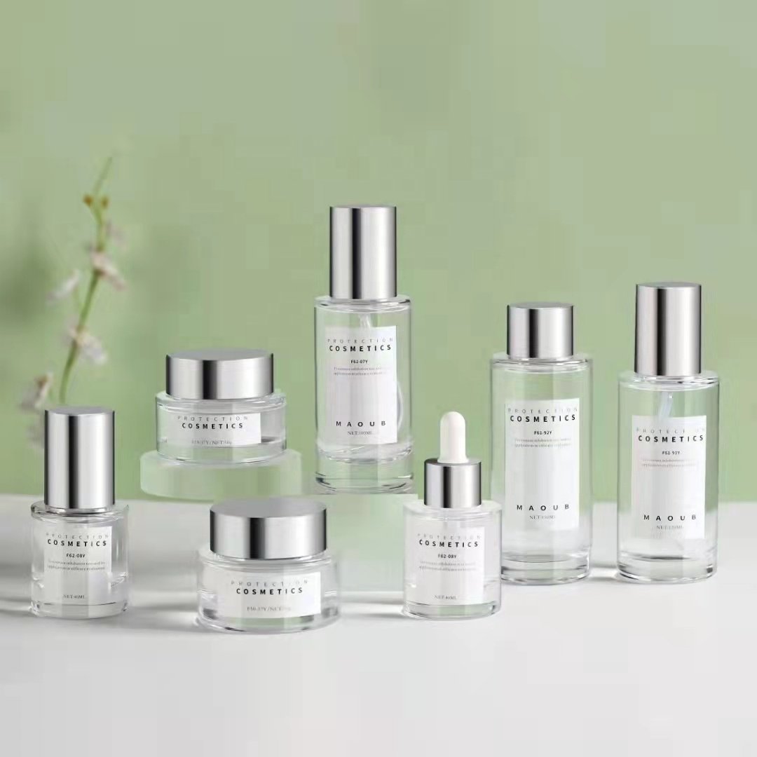 Wholesale Cosmetic packaging Cute 30ml 40ml 150ml Custom Private Label Glass Portable pump Bottle for cosmetic bottle set
