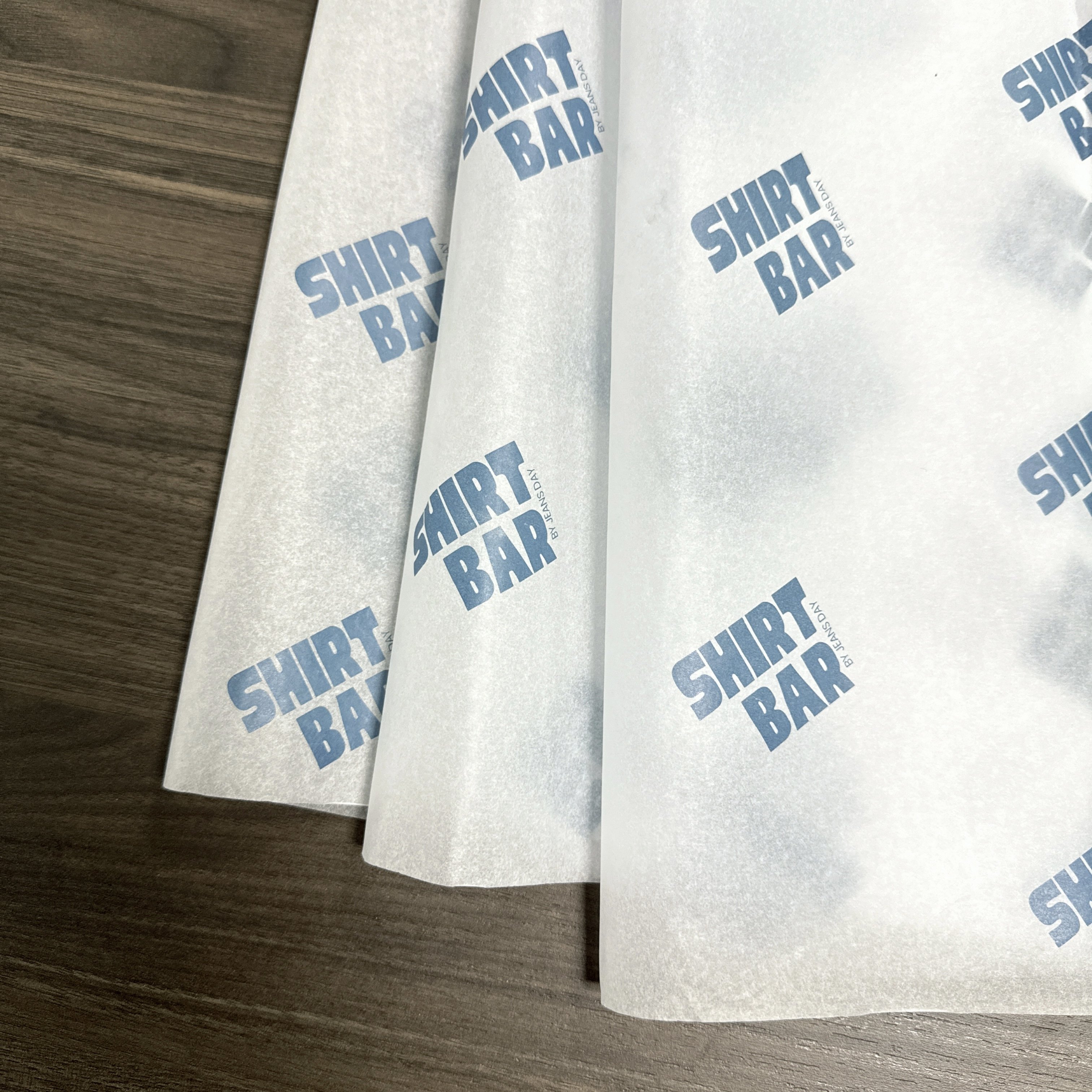 Refine Your Gift Presentation with Stylish Custom Logo Tissue Papers: Luxurious White and Bold Options for Clothing Wrapping