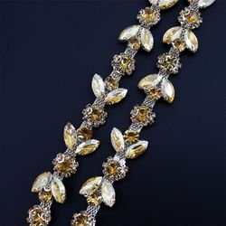 Crystal yellow ears on silver background
