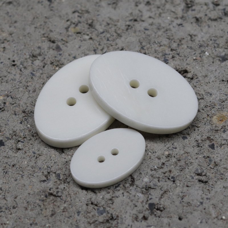 Oval 2-hole white real beef bone sweater buttons Custom natural buttons for high-end clothing custom color size logo
