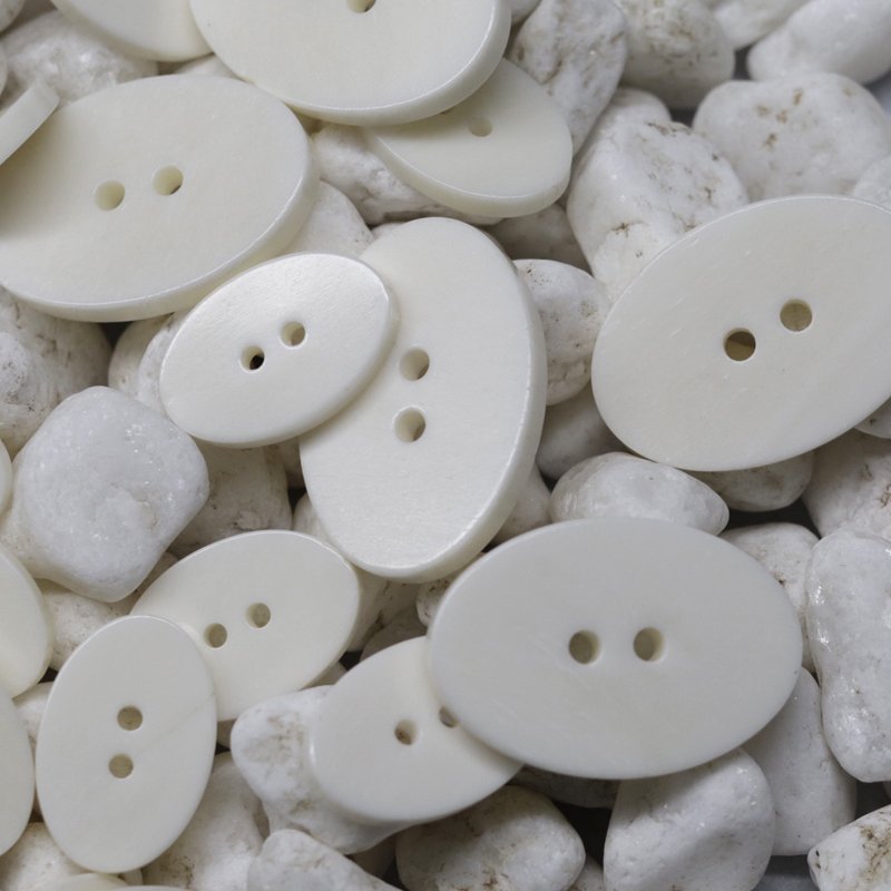 Oval 2-hole white real beef bone sweater buttons Custom natural buttons for high-end clothing custom color size logo