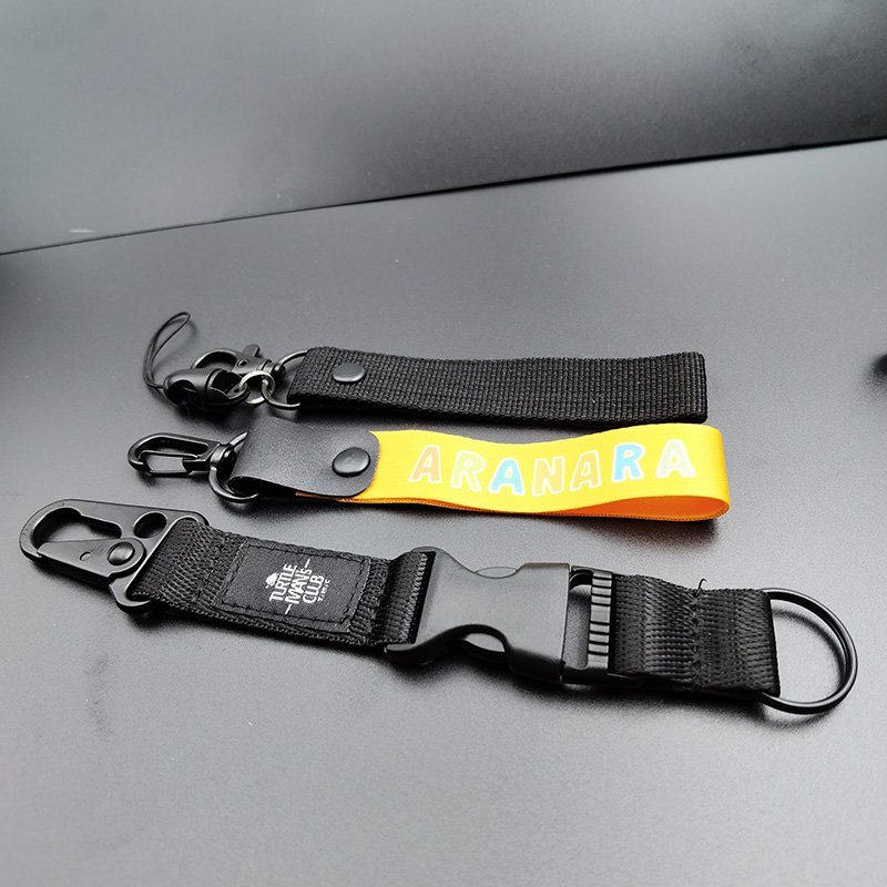 Custom black color nylon ribbon hard material one side rubber patch sewing logo outdoor strap wrist keychain short lanyard