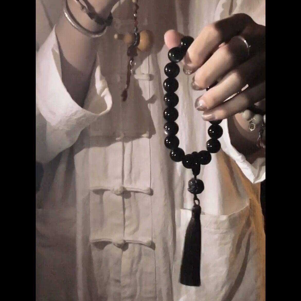 Explosive glazed obsidian hand holding around the finger soft hand quiet heart and ancient style