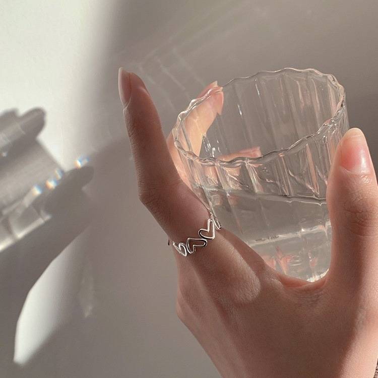 Hollow love ring, female opening niche design sense ins, cooled light wind feminine finger personality fashion ring
