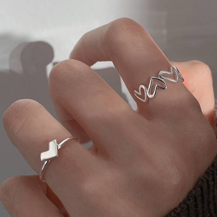 Hollow love ring, female opening niche design sense ins, cooled light wind feminine finger personality fashion ring