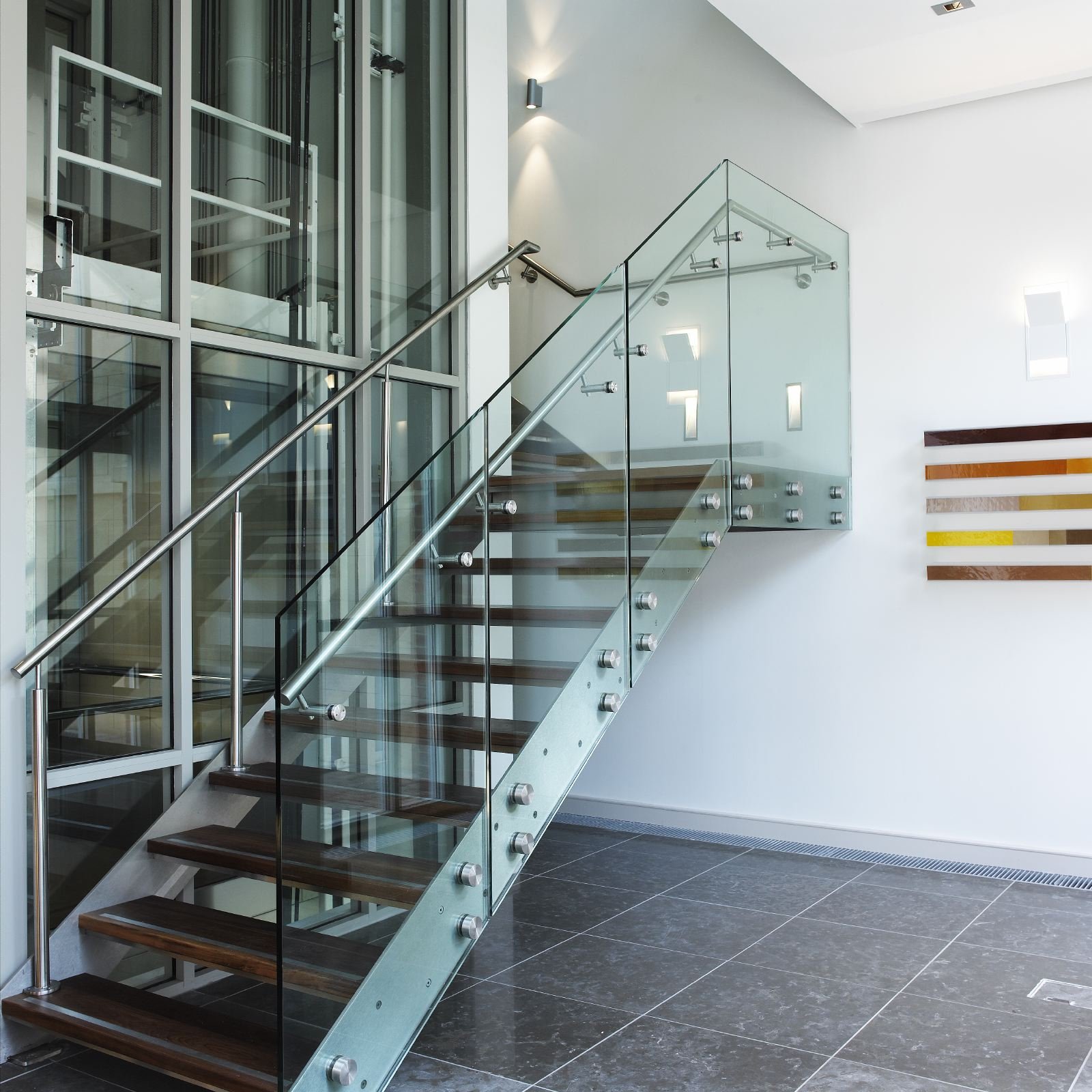 Modern Indoor Spiral Staircase with Wooden Carbon Steel Tread Steps Glass Railing and Iron Handrail Straight Style