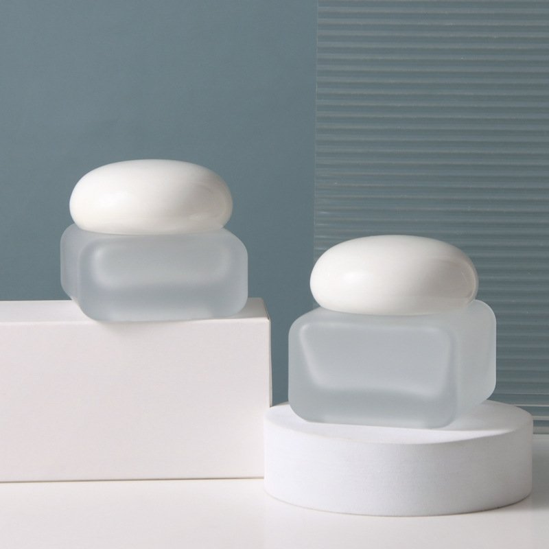 Customized Cosmetic frosted bottle transparent spray glass bottles Glass 100ml Cream bottle with stone lid