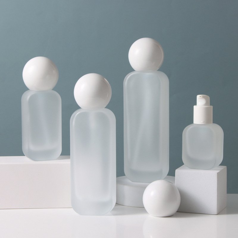 Customized Cosmetic frosted bottle transparent spray glass bottles Glass 100ml Cream bottle with stone lid
