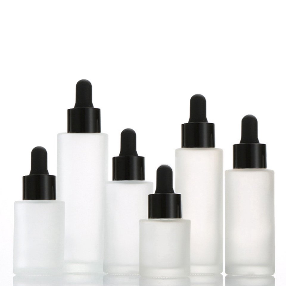 Cosmetic skincare essential oil bottle luxury flat shoulder frosted clear glass bottle 30ml with black lids