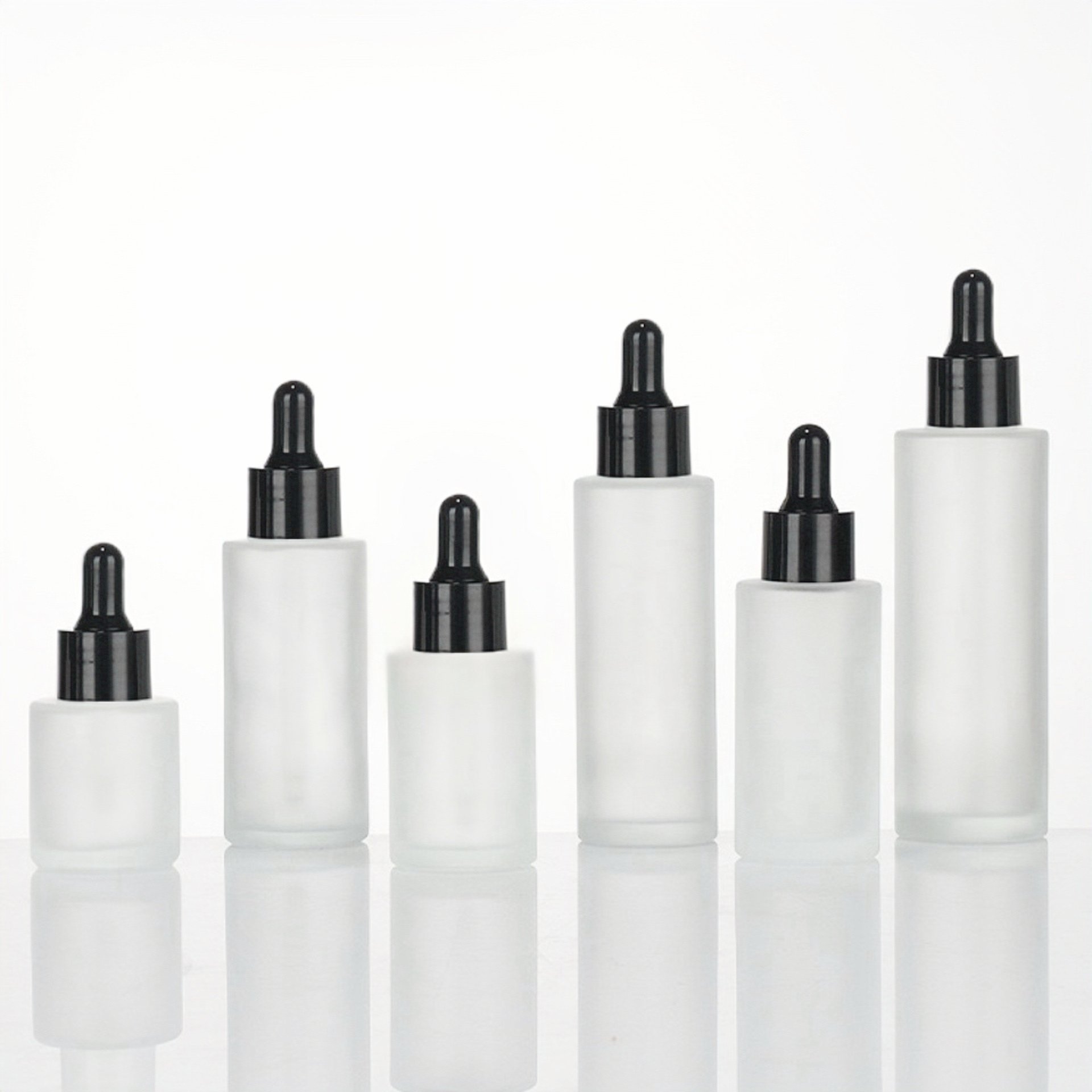 Cosmetic skincare essential oil bottle luxury flat shoulder frosted clear glass bottle 30ml with black lids