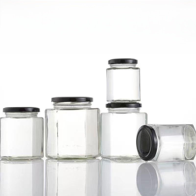 Wholesale point 250ml 500ml food storage bottle with lid, honey glass bottle, hexagonal golden spiral cap glass sealed jar