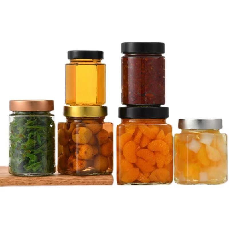 Wholesale point 250ml 500ml food storage bottle with lid, honey glass bottle, hexagonal golden spiral cap glass sealed jar