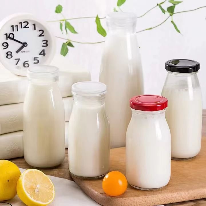 Hot Sale 500ml 750ml 1000ml Round Shape Glass Milk Juice Bottle With Lid
