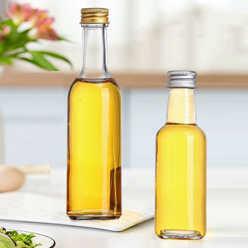 1oz Mini Clear Round Shape Glass Bottles 30ml 50ml 100ml Small Empty Glass Bottle With Lid Liquor Bottle