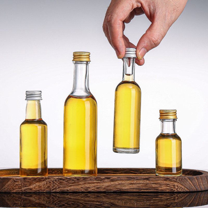 1oz Mini Clear Round Shape Glass Bottles 30ml 50ml 100ml Small Empty Glass Bottle With Lid Liquor Bottle
