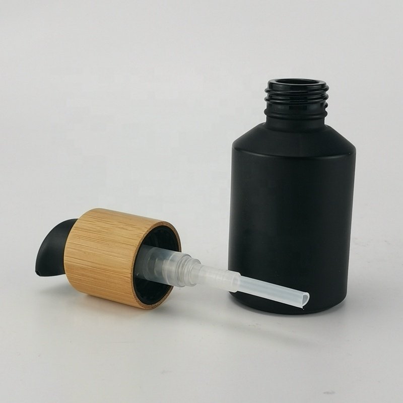 sloping shoulder glass bottle 60 ml matte black glass bottle 2 oz black frosted glass bottle with bamboo screw lid for cosmetic