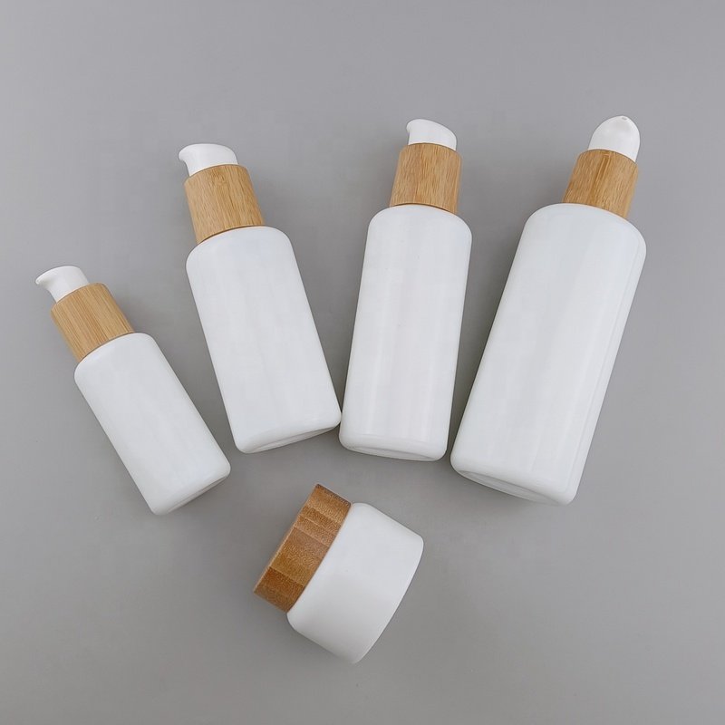 cosmetic opal glass bottle 40 ml 100 ml 120 ml 200 ml white glass bottle serum pump bottle and 50 ml glass jar with bamboo lid