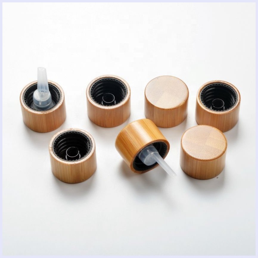 essential oil bottle 10ml 15ml 30ml 50ml 100ml empty cosmetic black glass bottle with bamboo cap reducer for body massage oil