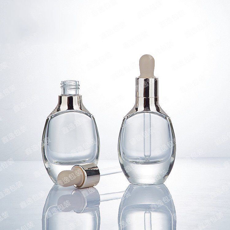 Custom luxury unique custom transparent skin care cosmetics glass bottle with dropper 15ml 30ml 50ml 100ml