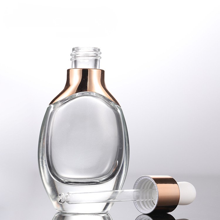 Custom luxury unique custom transparent skin care cosmetics glass bottle with dropper 15ml 30ml 50ml 100ml