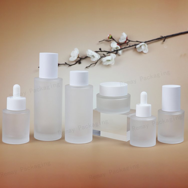 Customized High-End Glass Makeup Skin Care Packaging Set frosted Pressure Pump Spray Dropper Glass Bottle and cream Jar