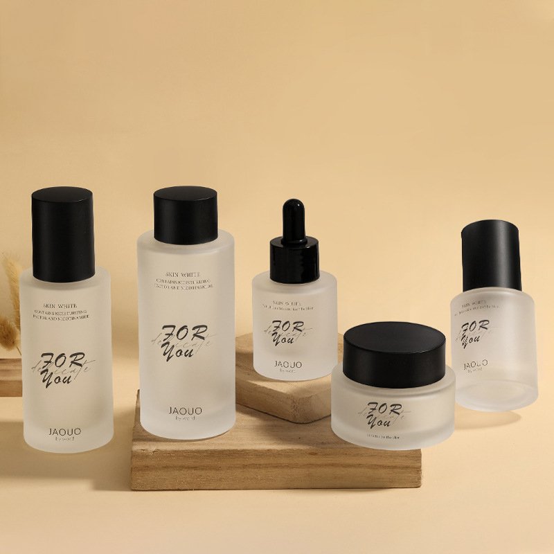 Customized High-End Glass Makeup Skin Care Packaging Set frosted Pressure Pump Spray Dropper Glass Bottle and cream Jar