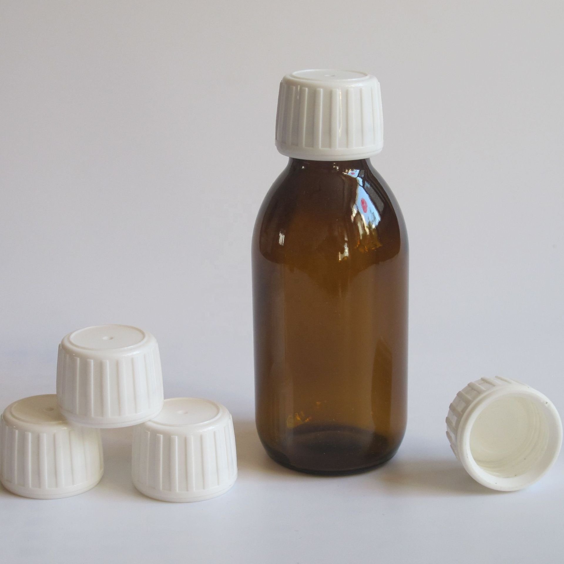 Hot sale 30ml 60ml 100ml 125ml 150ml 200ml 250ml amber syrup glass bottle with cap for drinking