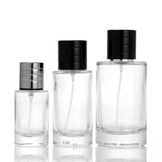 Glass perfume bottles 25ml 50ml 100ml wholesale luxury round transparent empty oil glass spray bottle with sprayer atomizer