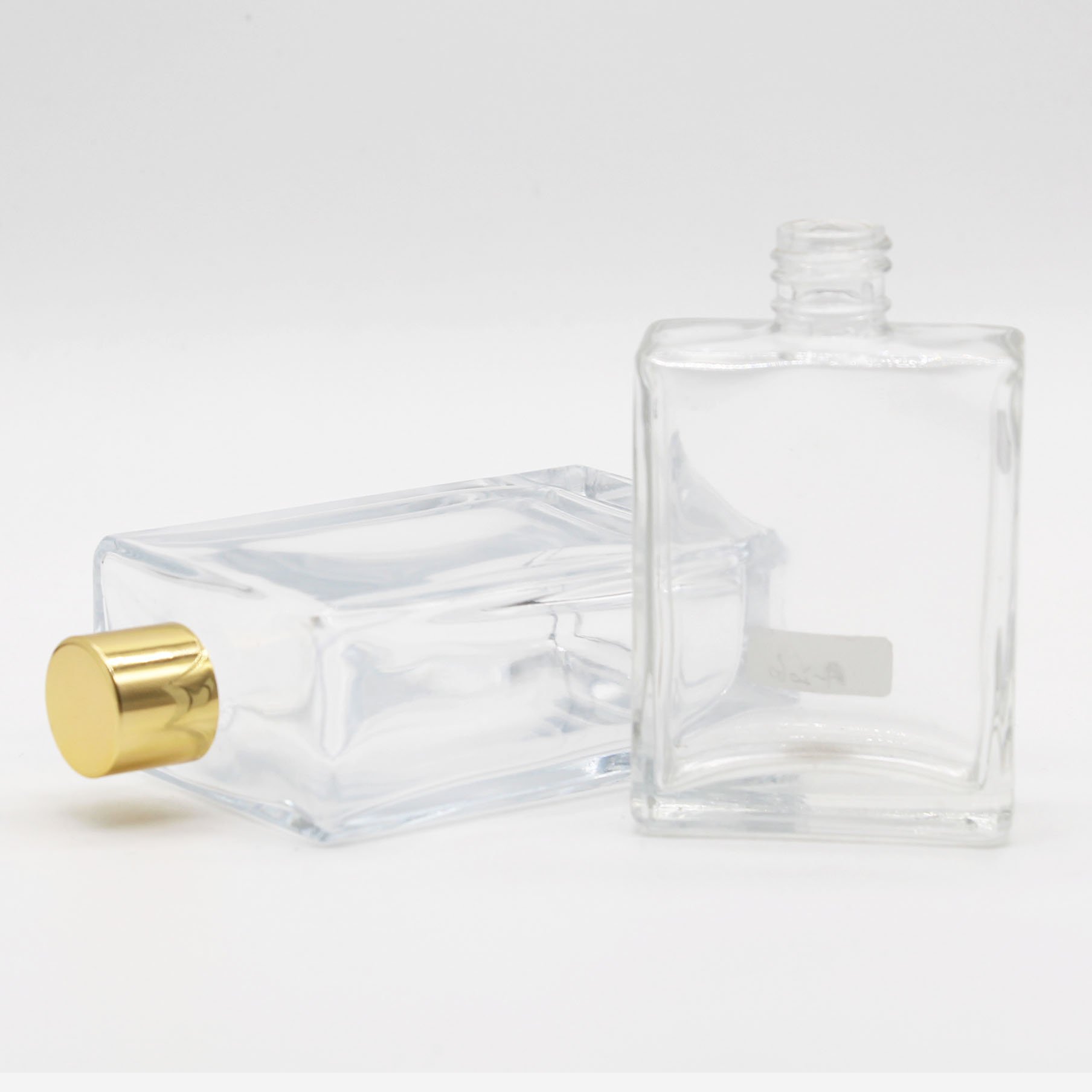 Hot sale 10ml 15ml 20ml 30ml 50ml luxury square glass transparent perfume bottle with pump cap screw cap