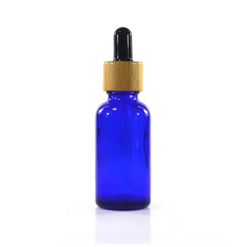 Wholesale empty matte blue amber green frosted glass dropper bottle with wooden cap for essential oil glass bottle bamboo lid