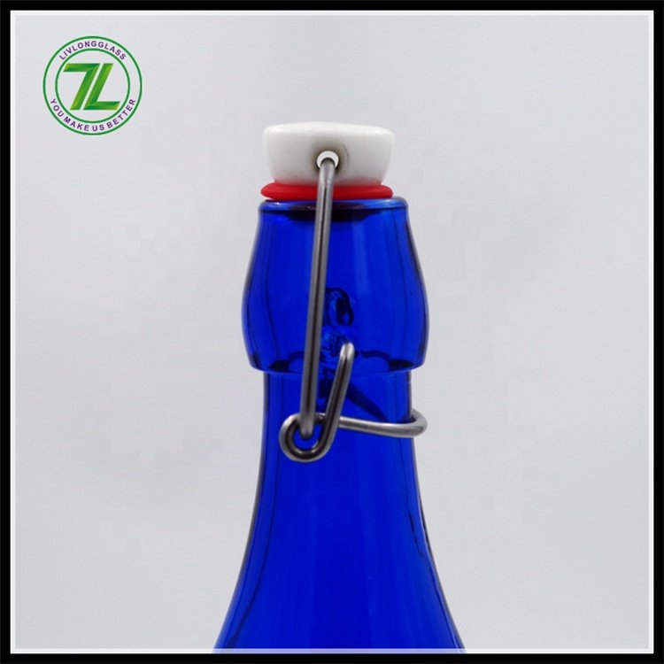 Hot sale 32oz cobalt blue round glass bottle aerated water glass bottle with clip top for beer liquor juice beverage