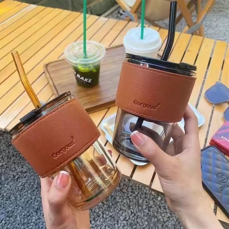 Sell well 400ml Clear Glass Slub Cup With Lid Straw Custom Logo Simple Glass Coffee Cup With Leather Case
