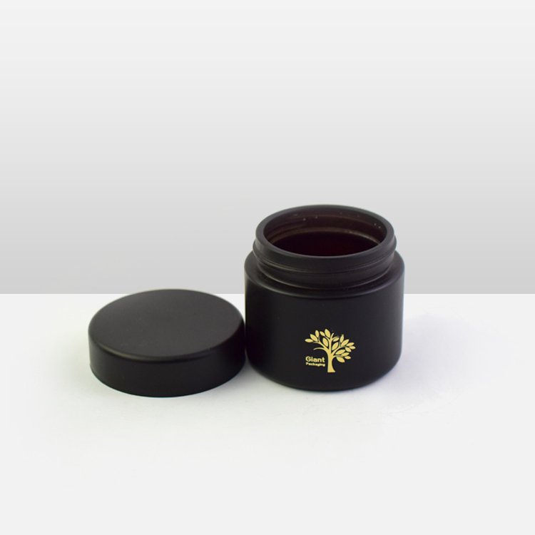 Custom Flower Packaging 57mm Diameter Glass Jar Label Custom Design Frosted Cream Black UV Glass Scrub Cosmetic Jar Glass Bottle