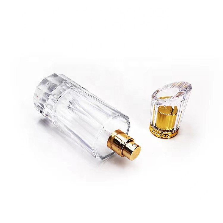 Empty luxury perfume glass bottles wholesale 50ml round glass perfume bottles cosmetic glass spray bottle with pump atomizer