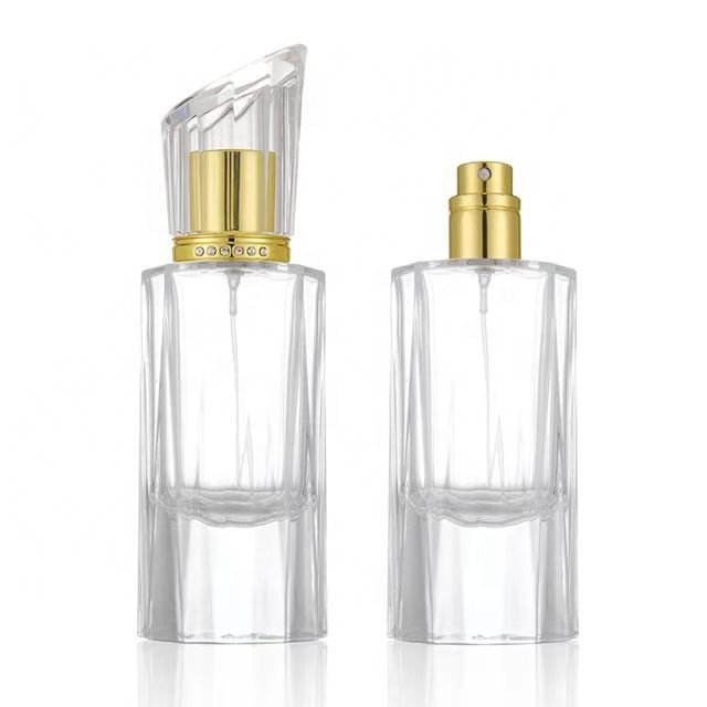 Empty luxury perfume glass bottles wholesale 50ml round glass perfume bottles cosmetic glass spray bottle with pump atomizer