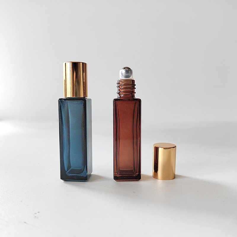 Perfumes roll on bottle 10ml amber blue square glass bottle with steel roller shiny gold cap cosmetic packaging bottle for oils