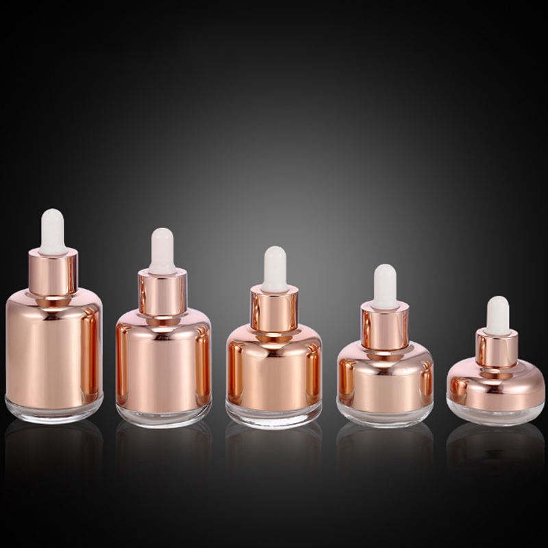 Wholesale cylinder 20ml 30ml 50ml 100ml essential oil glass bottle with golden shoulder shank dropper cap